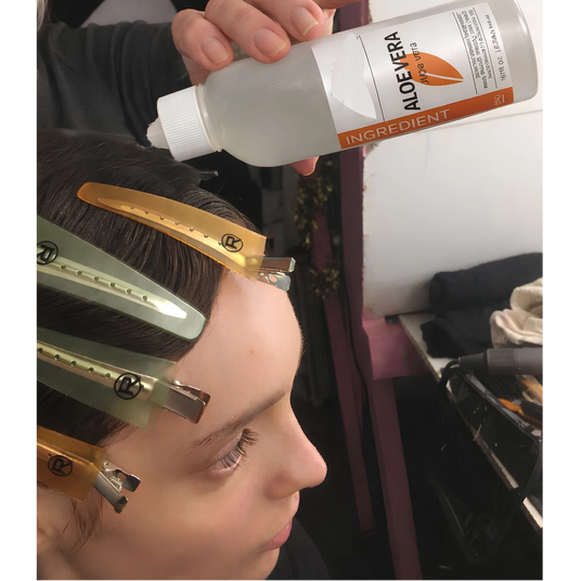 Behind the scenes on a Vogue Italia shoot, Jill applying Aloe Vera to the hair